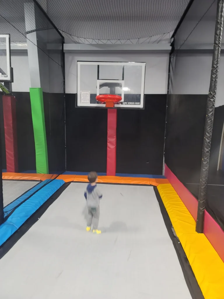 Child on the slam-dunk trampoline lane at Valley Jump Park in Penn Laird, VA